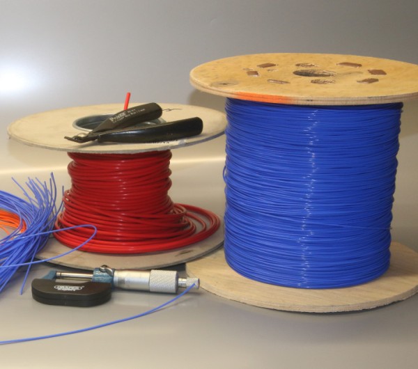 Reels of silver-plated, multi-stranded copper wire insulated with PTFE that Wire on Wire use to hand-make their audio cables and speaker cables with